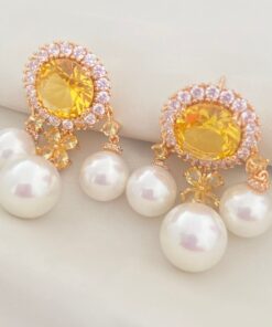 Brinco citrino com pérola