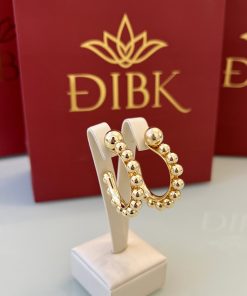 Brinco meia-argola esferas douradas